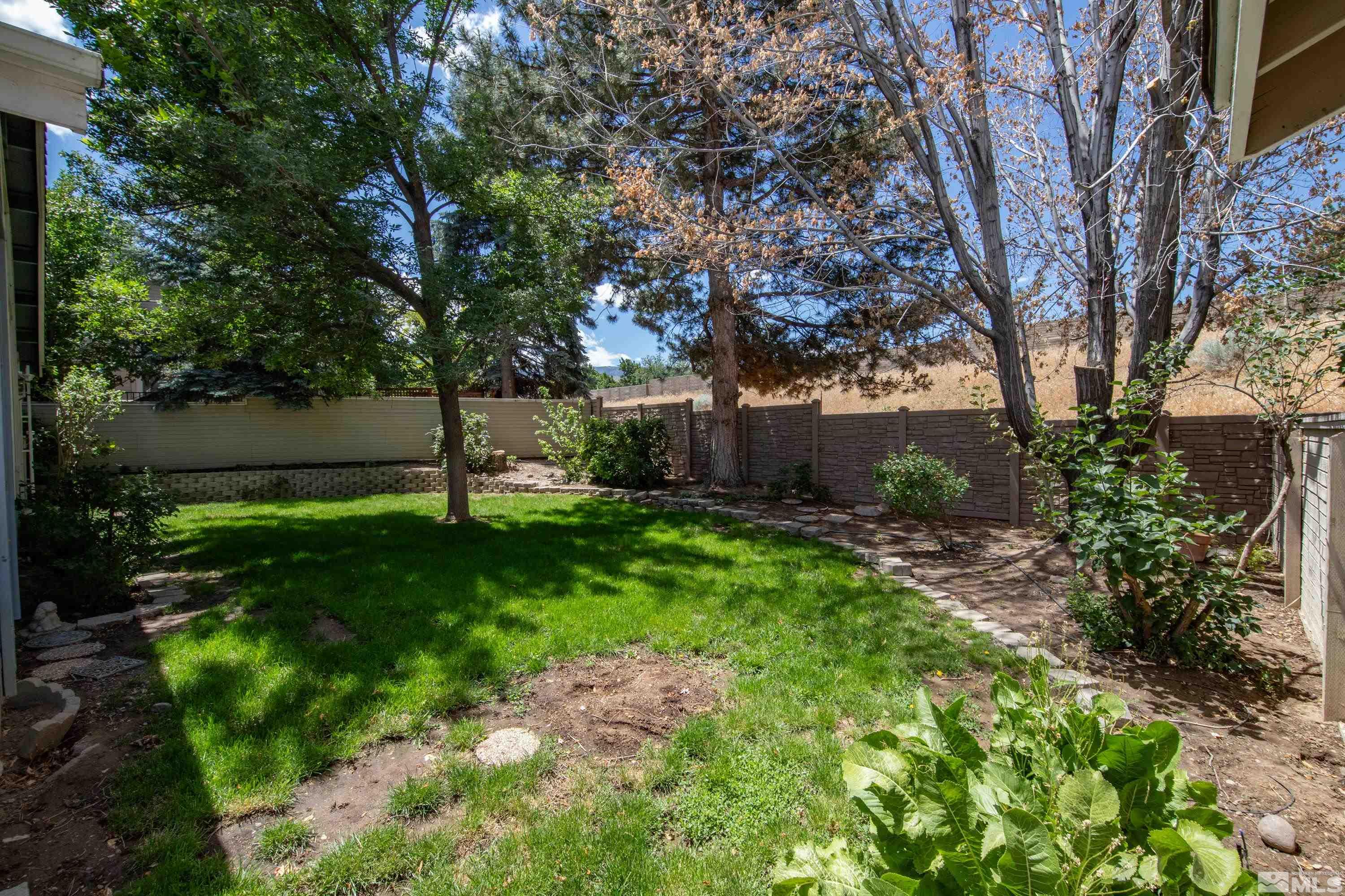 3336 Spring Creek Circle Reno, NV 89509 - Photo 34 of 36 a view of a backyard with large trees