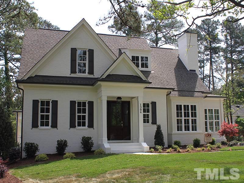 1304 Duplin Road Raleigh, NC 27607 - Photo 1 of 25 a front view of a house with a yard