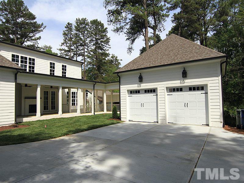 1304 Duplin Road Raleigh, NC 27607 - Photo 2 of 25 a front view of a house with a yard and garage