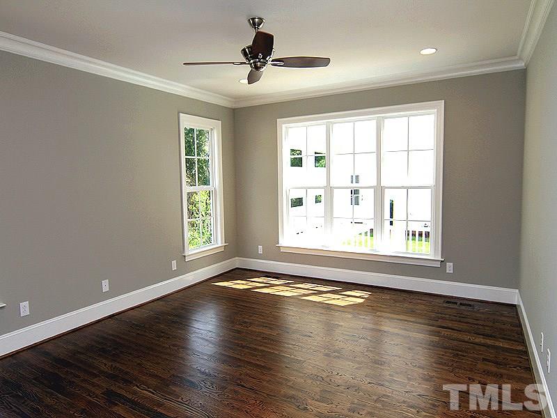 1304 Duplin Road Raleigh, NC 27607 - Photo 16 of 25 a view of an empty room with wooden floor and a window