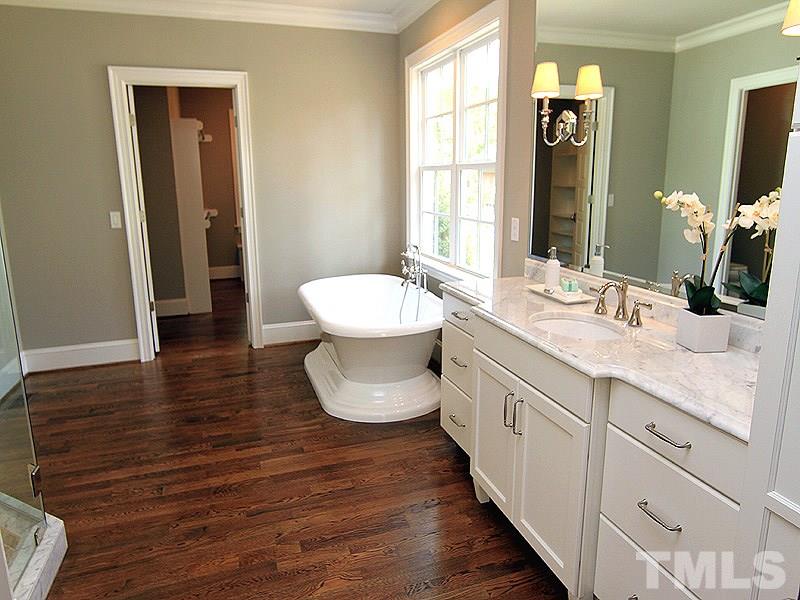 1304 Duplin Road Raleigh, NC 27607 - Photo 17 of 25 a bathroom with a sink and a mirror