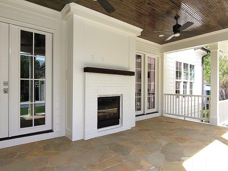 1304 Duplin Road Raleigh, NC 27607 - Photo 24 of 25 a view of a livingroom with a fireplace and stairs