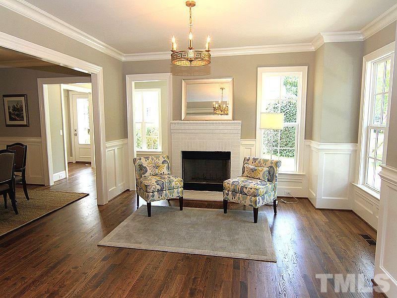 1304 Duplin Road Raleigh, NC 27607 - Photo 4 of 25 a living room with furniture wooden floor and a fireplace