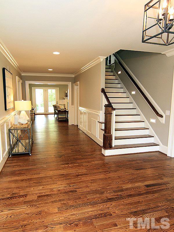 1304 Duplin Road Raleigh, NC 27607 - Photo 6 of 25 a view of an empty room with stairs and a rug
