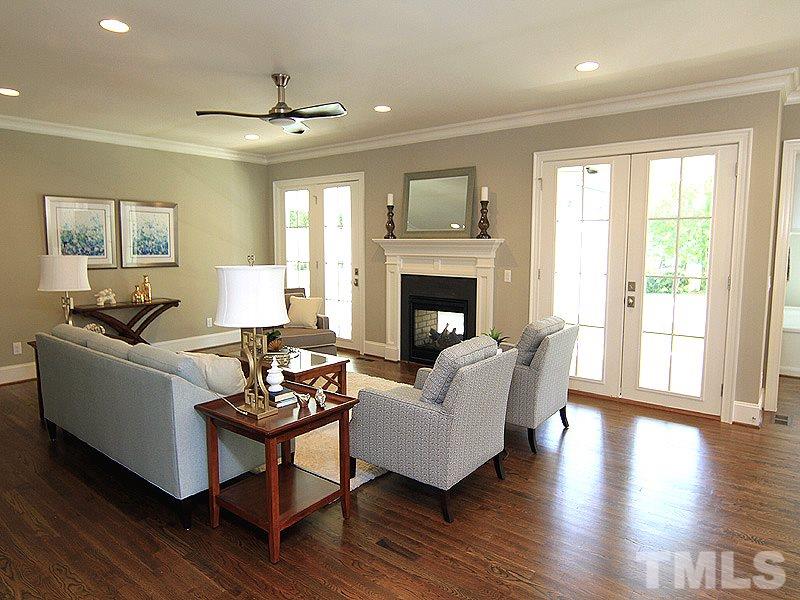 1304 Duplin Road Raleigh, NC 27607 - Photo 8 of 25 a living room with furniture and a fireplace