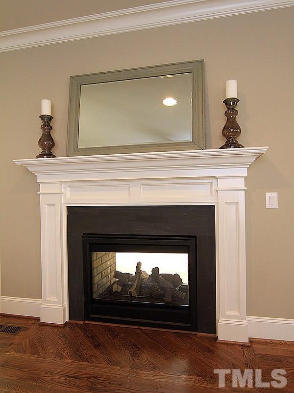 1304 Duplin Road Raleigh, NC 27607 - Photo 9 of 25 a living room with a fireplace