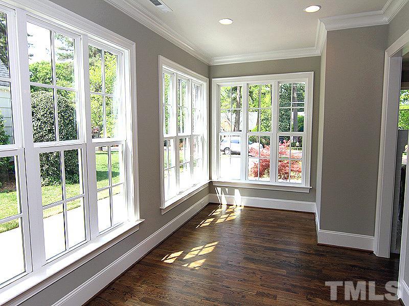 1304 Duplin Road Raleigh, NC 27607 - Photo 10 of 25 a view of an empty room with wooden floor and a window