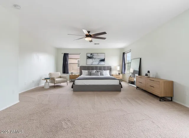 a bedroom with furniture and a chandelier