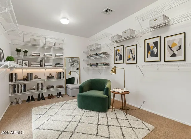 a living room with furniture and air hockey table