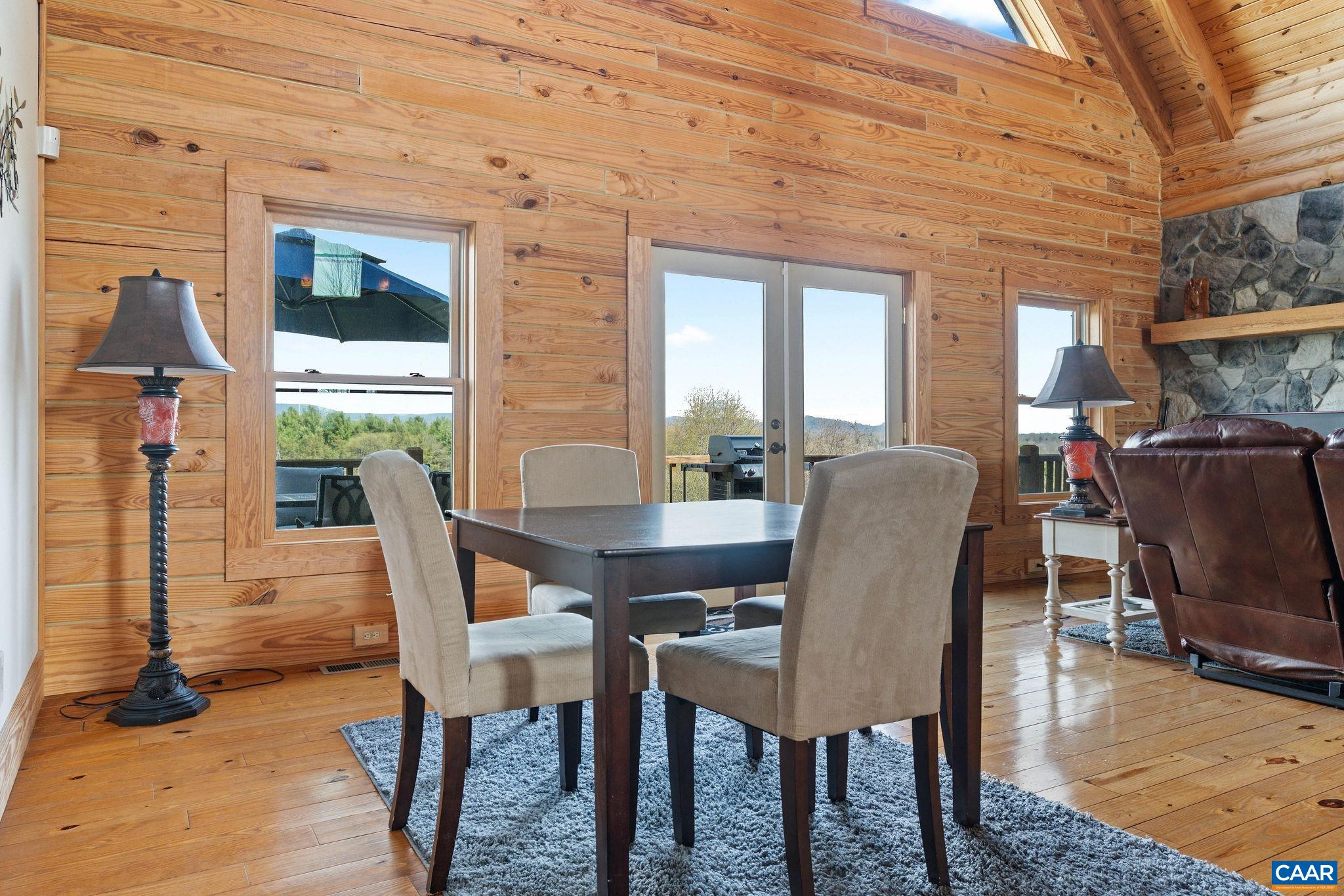 42 River Ridge Lane Stanardsville, VA 22973 - Photo 13 of 70 a view of a dining room with furniture window and wooden floor
