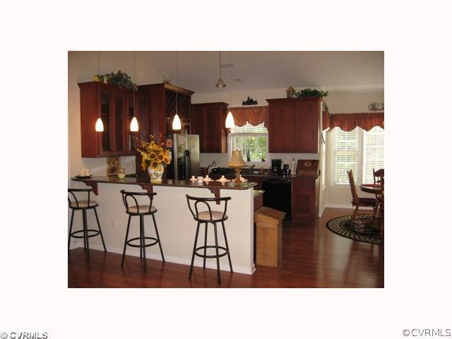 2003 Burkeville Road Victoria, VA 23974 - Photo 3 of 12 a dining room with furniture and a chandelier