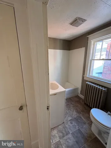 a bathroom with a sink and toilet
