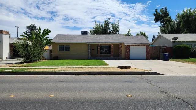 a house view with a garden space