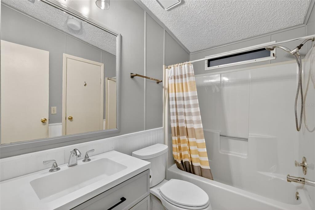 3324 Myakka River Road Tavares, FL 32778 - Photo 20 of 35 a bathroom with a sink toilet and shower