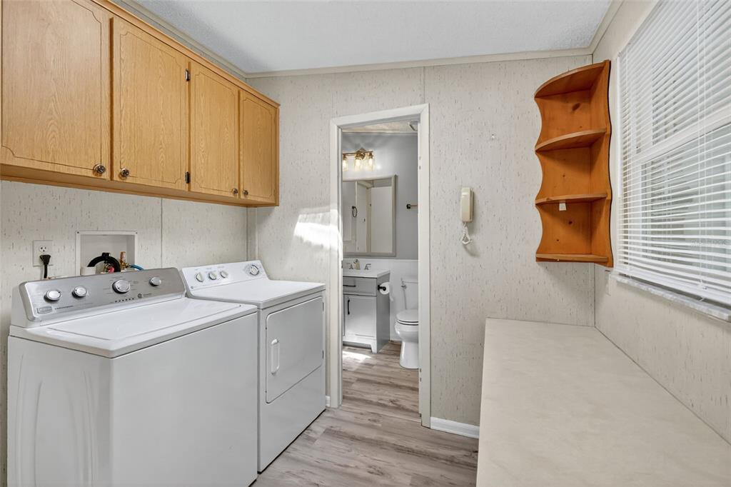 3324 Myakka River Road Tavares, FL 32778 - Photo 22 of 35 a utility room with dryer and washer