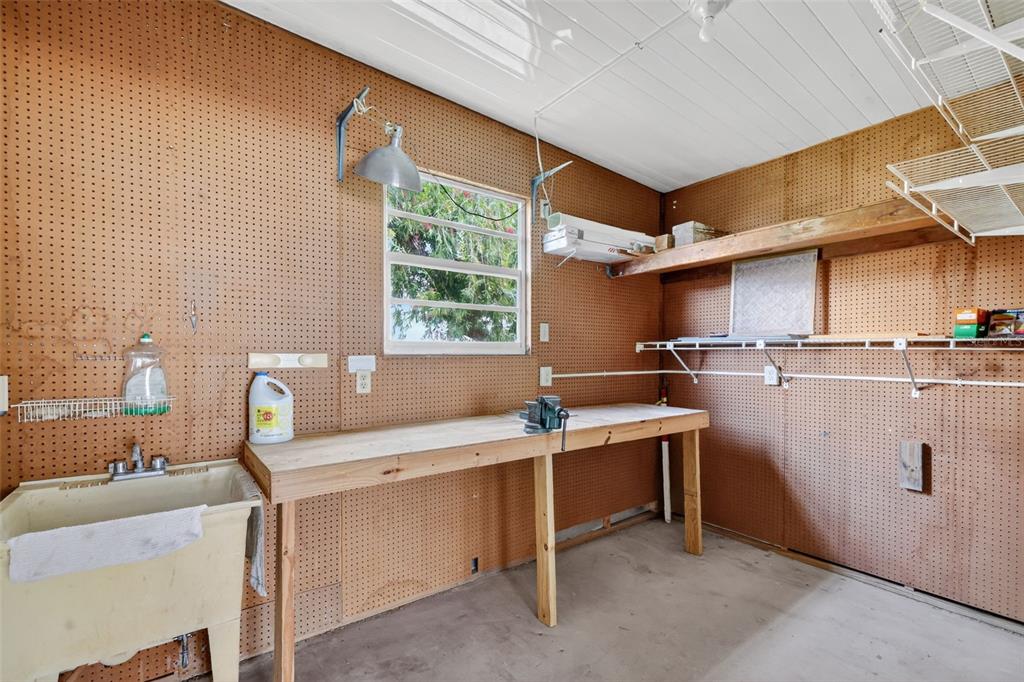 3324 Myakka River Road Tavares, FL 32778 - Photo 26 of 35 a room with a sink cabinets and window