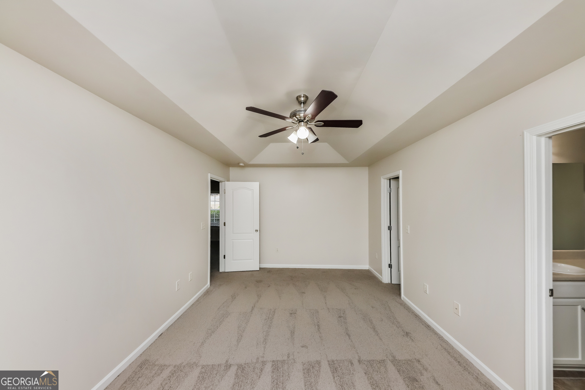 102 Rocky Branch Way Villa Rica, GA 30180 - Photo 11 of 16 a view of an empty room with a ceiling fan