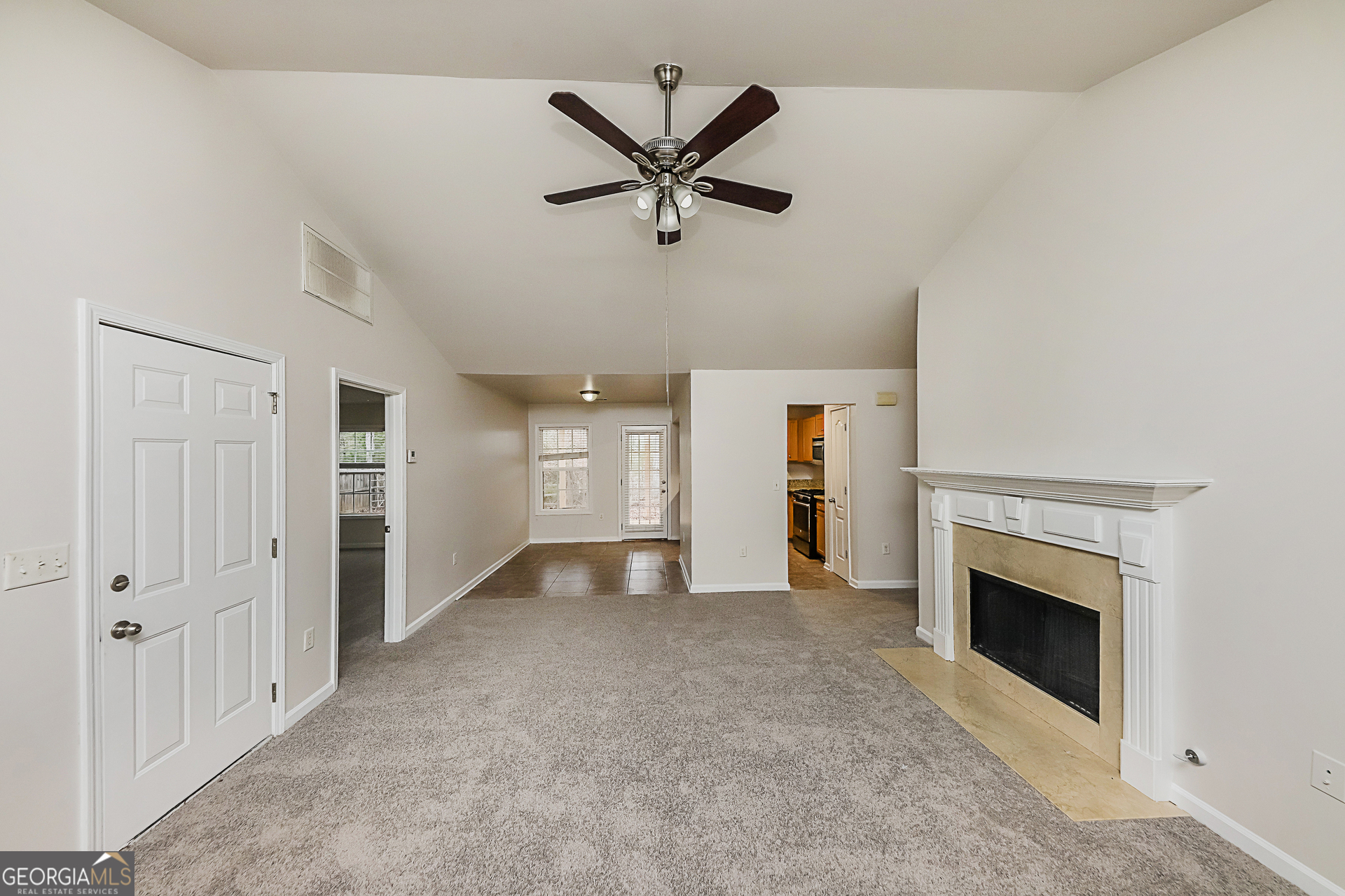 102 Rocky Branch Way Villa Rica, GA 30180 - Photo 3 of 16 wooden floor with ceiling fan and a fireplace