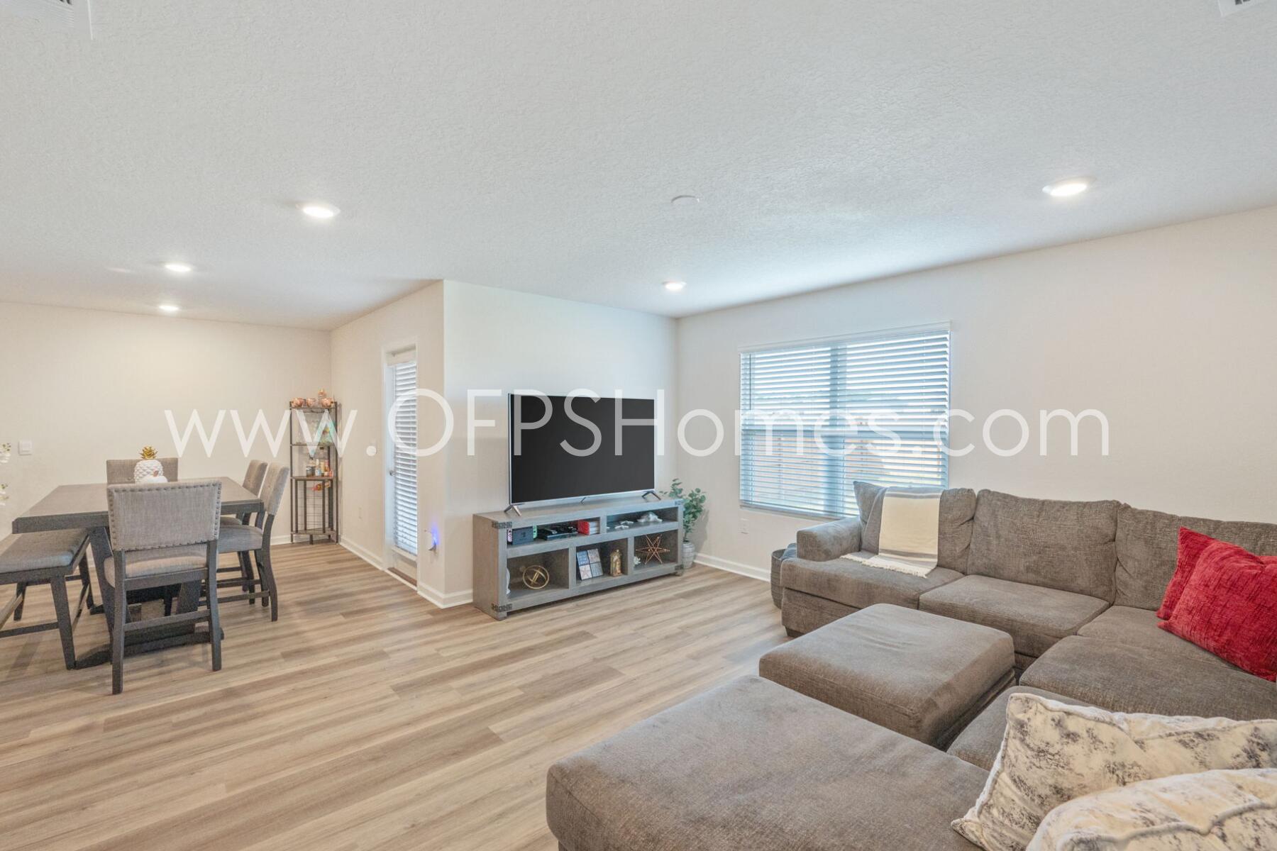 4618 Naval Court Crestview, FL 32539 - Photo 3 of 34 a living room with furniture and a flat screen tv