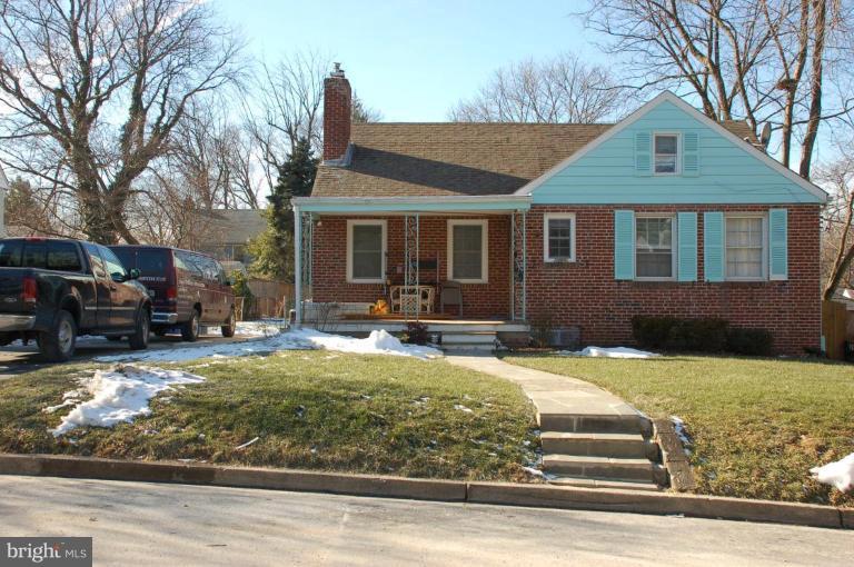 9310 Sudbury Road Silver Spring, MD 20901 - Photo 1 of 1 a front view of a house with a yard