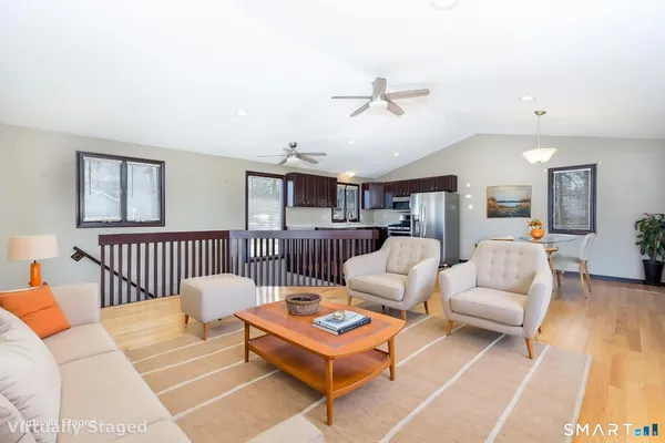 a living room with furniture and a table