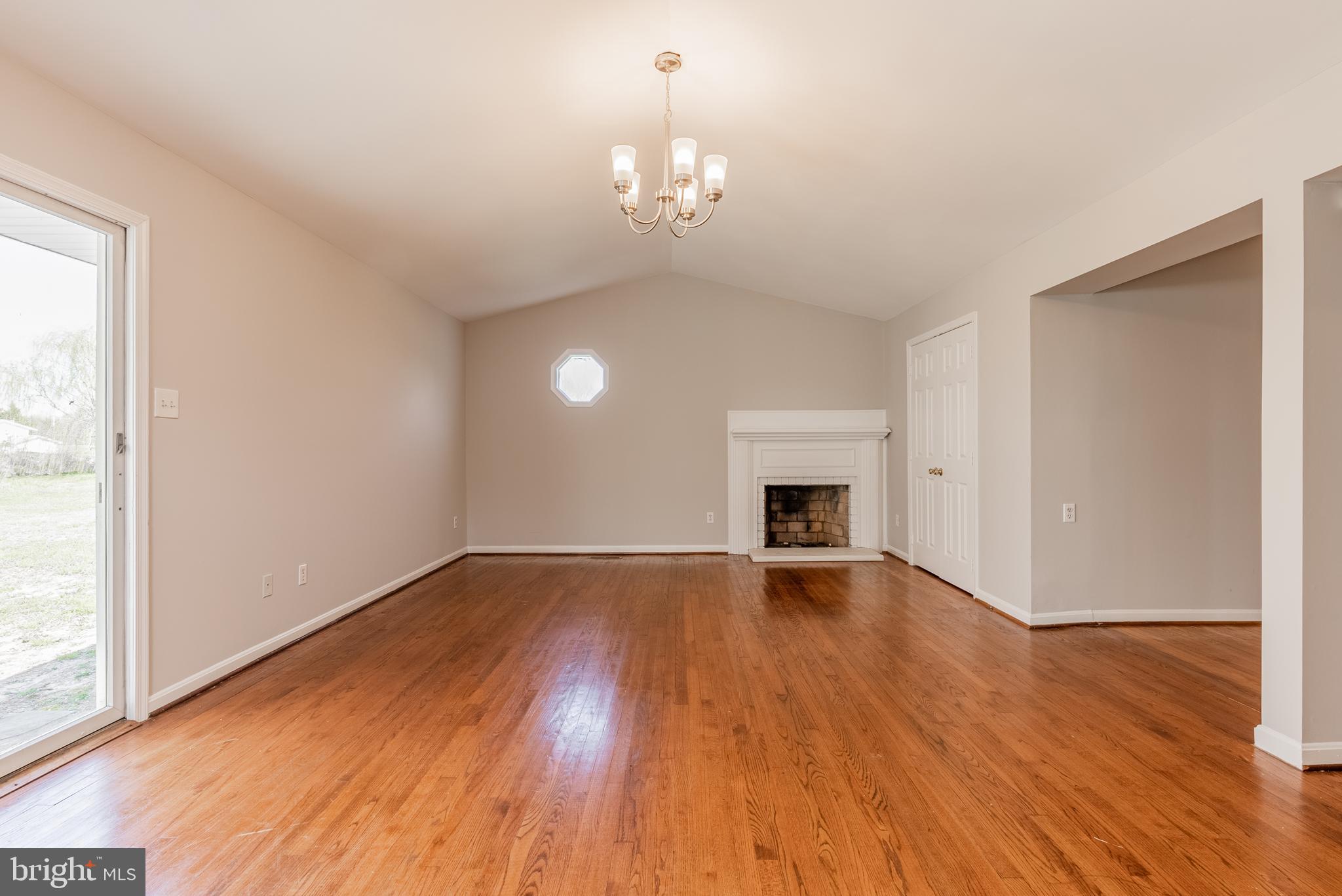 28405 Thompson Corner Road Mechanicsville, MD 20659 - Photo 14 of 29 Primary bedroom w/vaulted ceiling wood fireplace