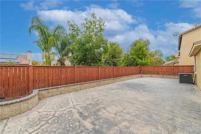 a front view of house with a garden