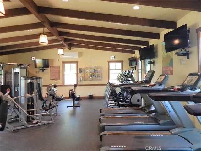 a lobby with furniture and stairs
