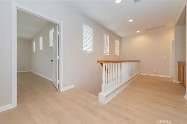 a living room with furniture and a piano