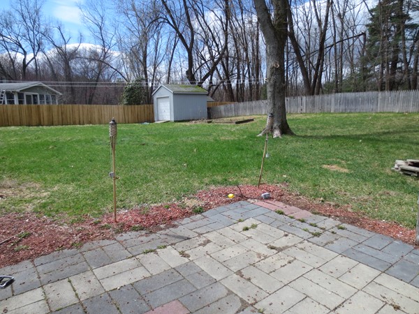 40 Pecousic Street Springfield, MA 01108 - Photo 7 of 19 a view of a backyard with a garden