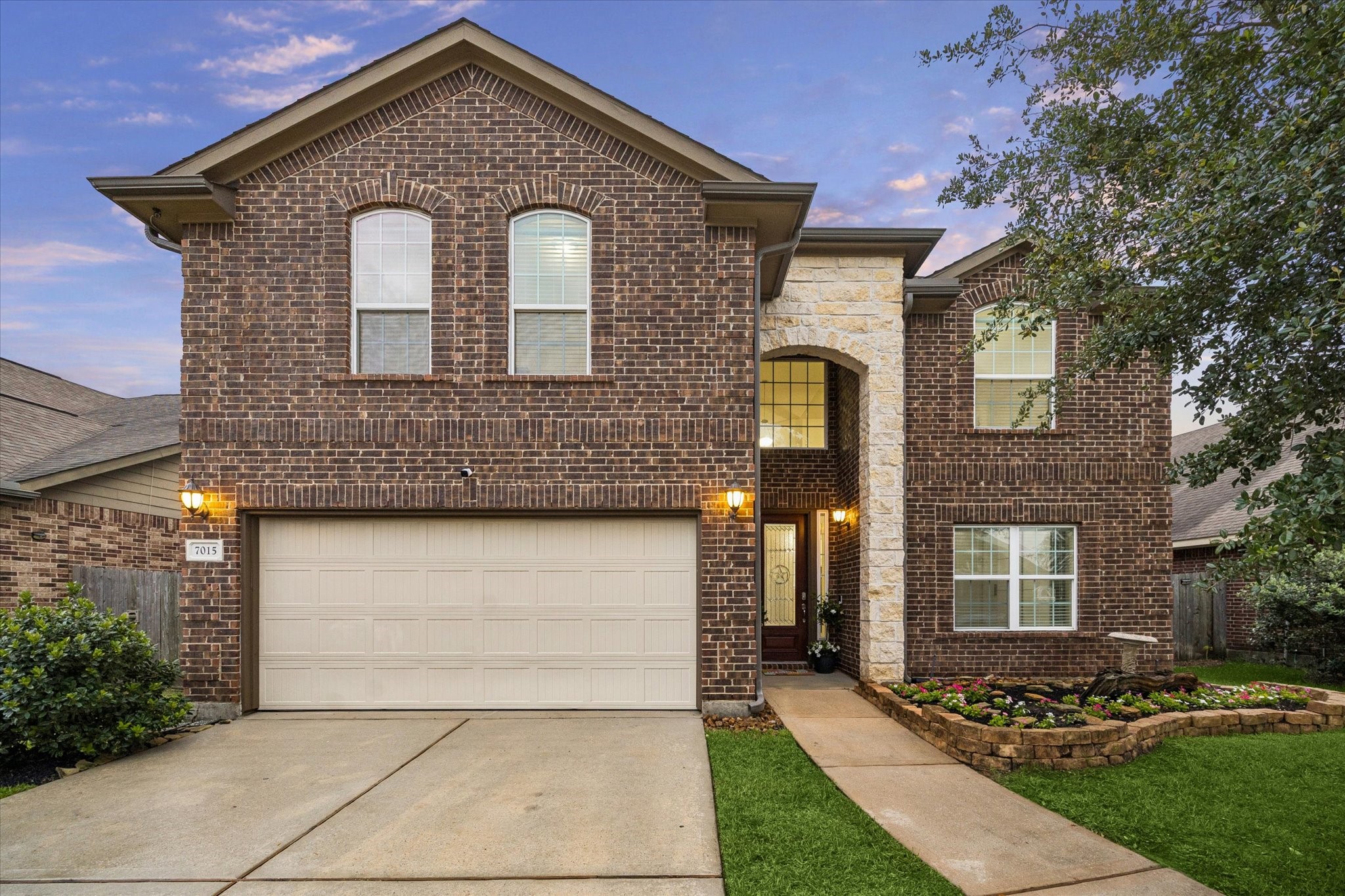 7015 Riata Hills Lane Spring, TX 77379 - Photo 33 of 33 Beautifully maintained two-story brick and stone home featuring timeless curb appeal and a welcoming entry. This spacious residence offers an open, functional floor plan with generous living areas, neutral finishes, and abundant natural light throughout. The kitchen opens seamlessly to the main living space, making it ideal for everyday living and entertaining.