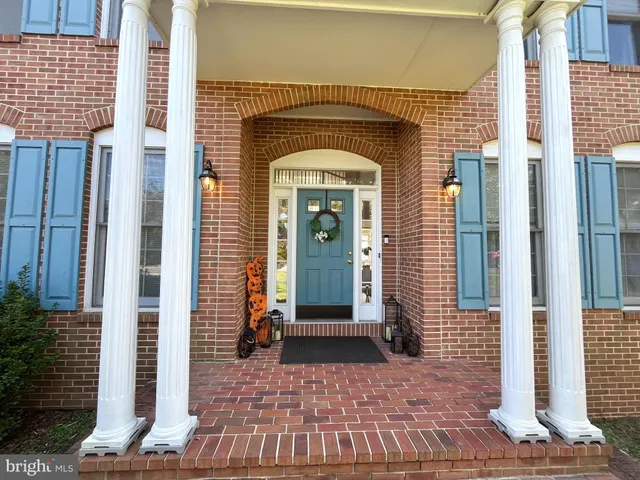 a front view of a house with a glass door