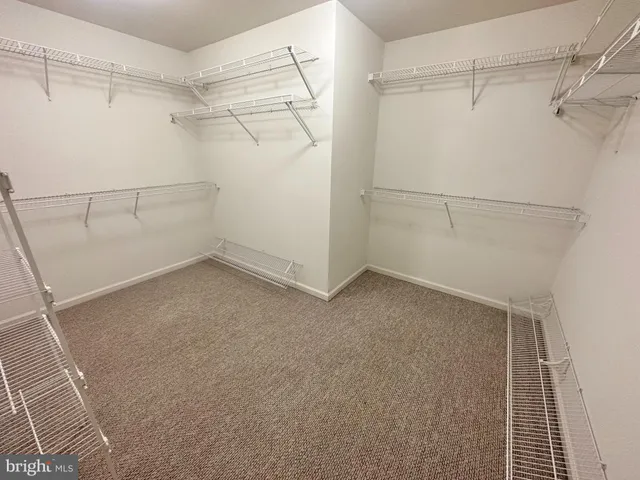 a view of a room with racks on the wall