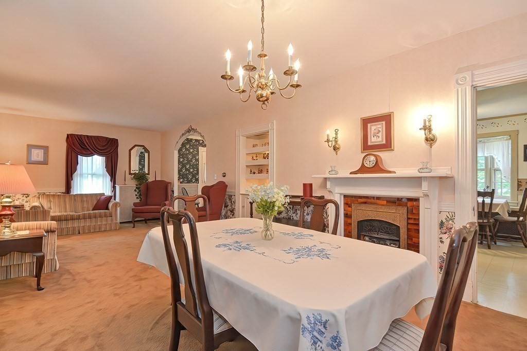 727 Main Street Woburn, MA 01801 - Photo 12 of 40 a view of a a dining room with furniture window and wooden floor