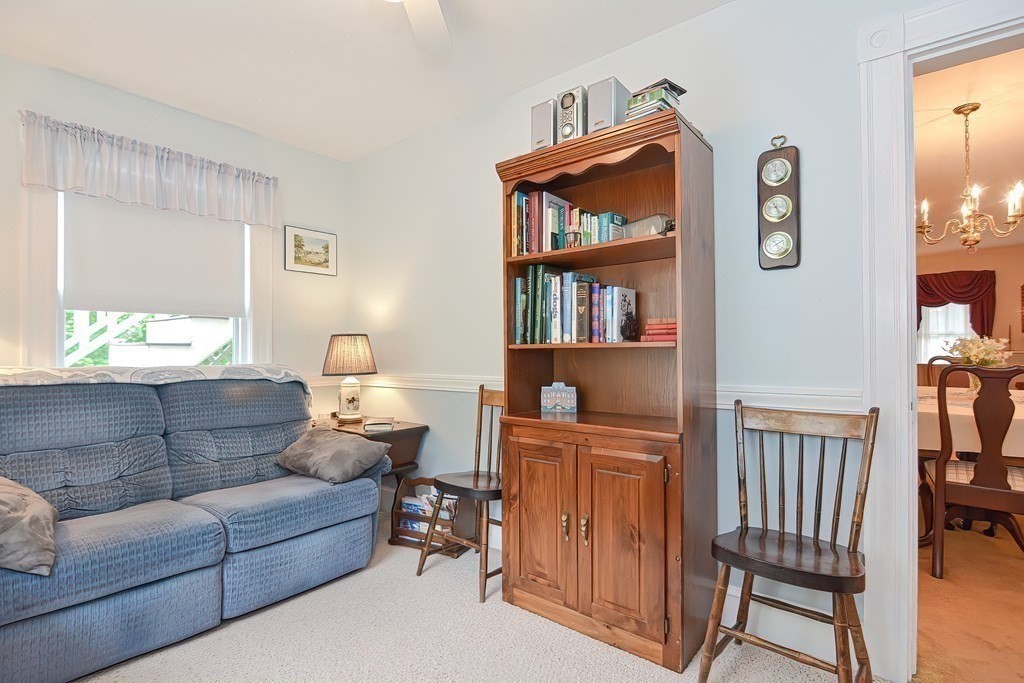 727 Main Street Woburn, MA 01801 - Photo 13 of 40 a living room with furniture and a window