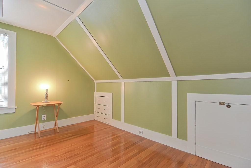 727 Main Street Woburn, MA 01801 - Photo 26 of 40 a view of an empty room with wooden floor