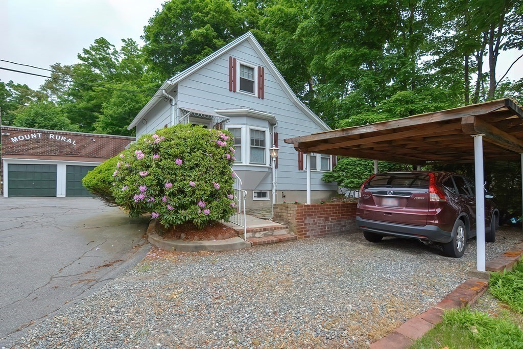 727 Main Street Woburn, MA 01801 - Photo 28 of 40 a view of house with backyard and outdoor seating