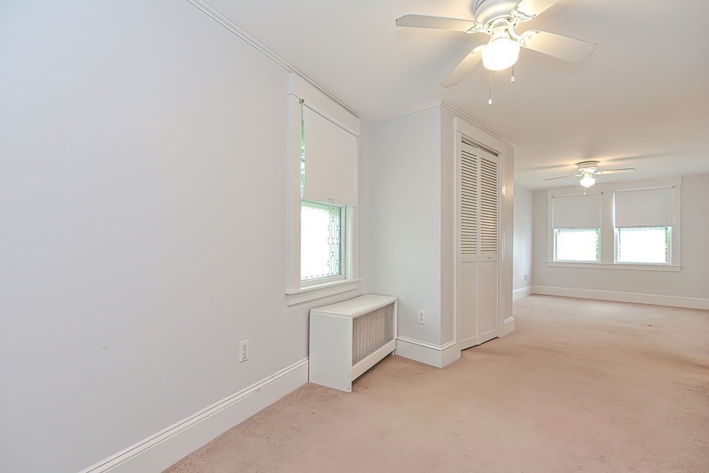 727 Main Street Woburn, MA 01801 - Photo 32 of 40 wooden floor in an empty room with a window