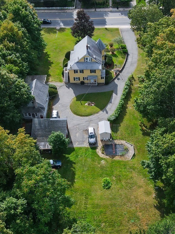727 Main Street Woburn, MA 01801 - Photo 36 of 40 an aerial view of a house with outdoor space pool seating area and yard