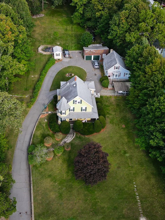 727 Main Street Woburn, MA 01801 - Photo 38 of 40 an aerial view of a house with outdoor space swimming pool and lake view