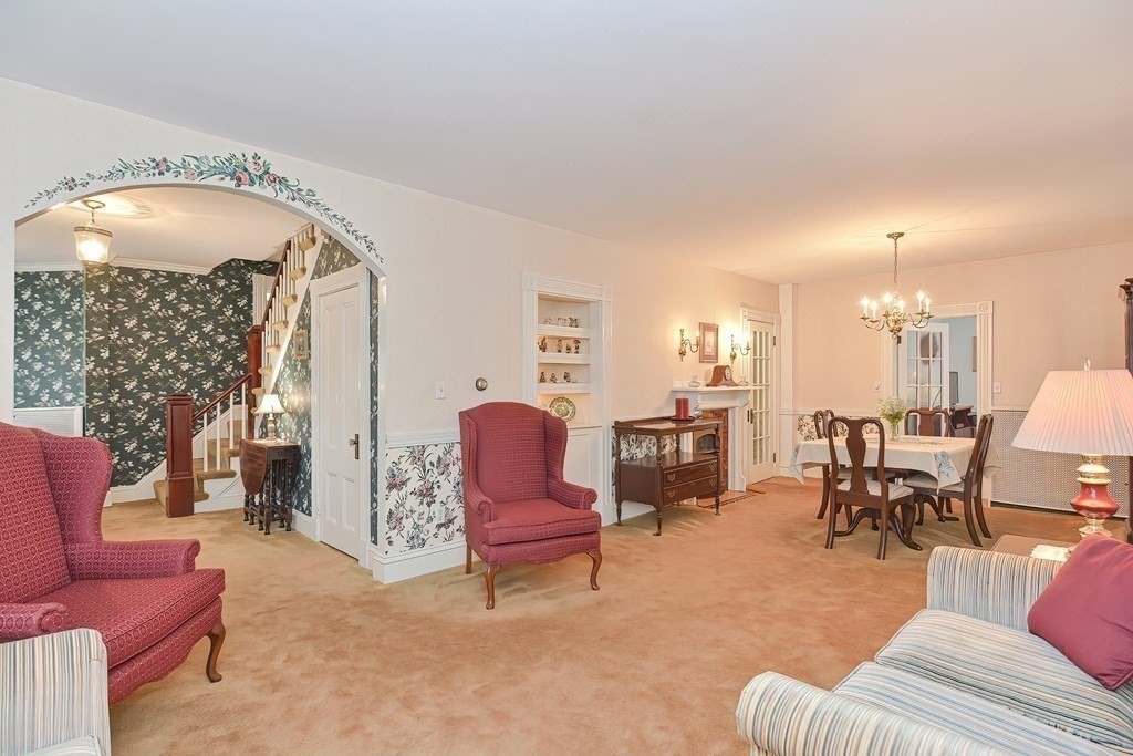 727 Main Street Woburn, MA 01801 - Photo 4 of 40 a living room with furniture and a fireplace