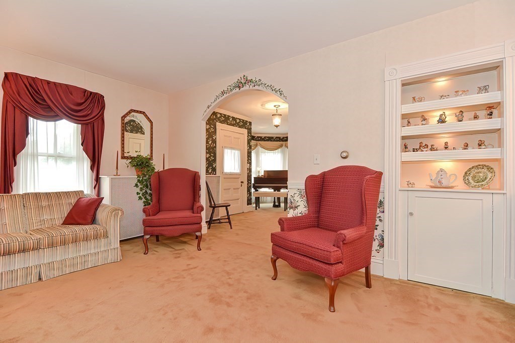 727 Main Street Woburn, MA 01801 - Photo 5 of 40 a living room with furniture and a potted plant