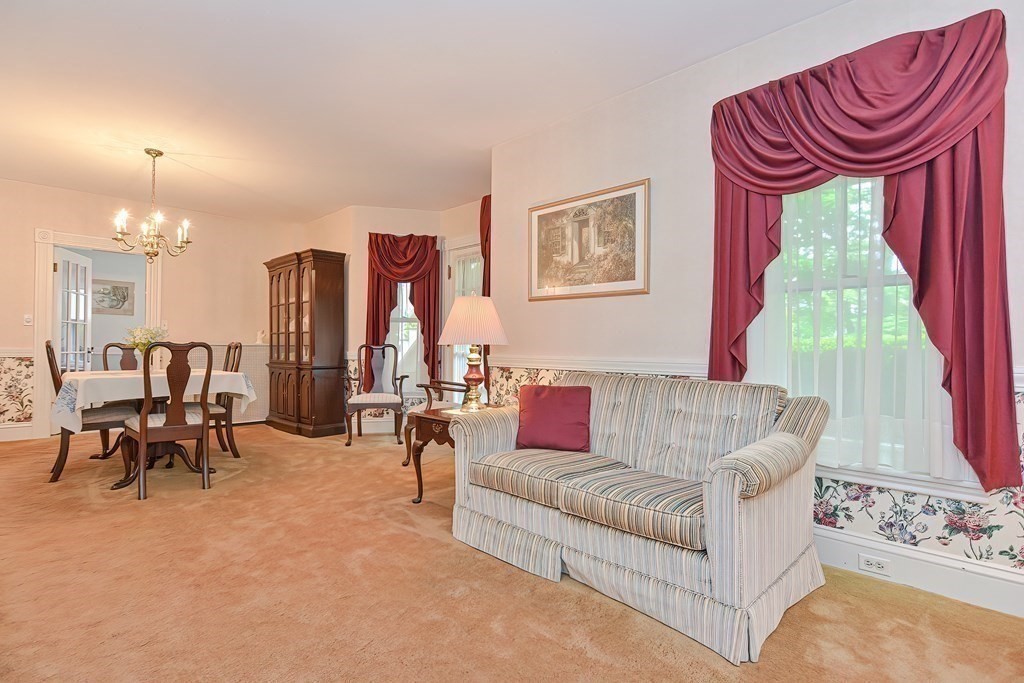 727 Main Street Woburn, MA 01801 - Photo 10 of 40 a living room with furniture and a large window