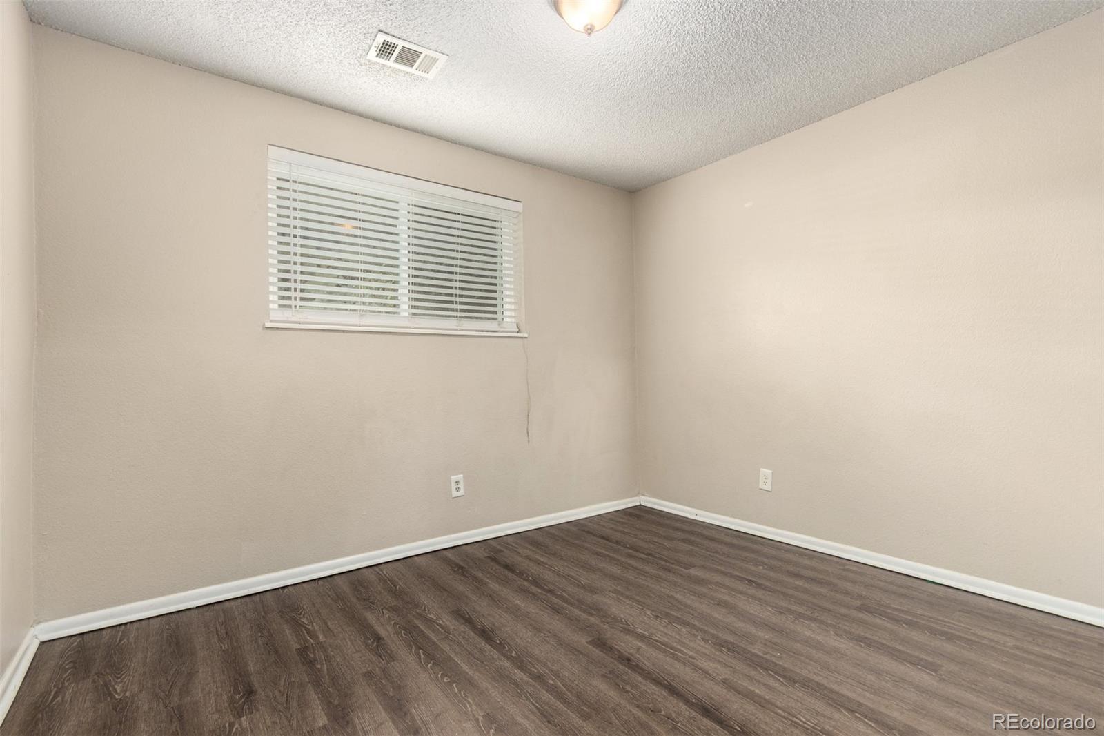 16359 West 10th Avenue, Unit O Golden, CO 80401 - Photo 16 of 25 wooden floor in an empty room
