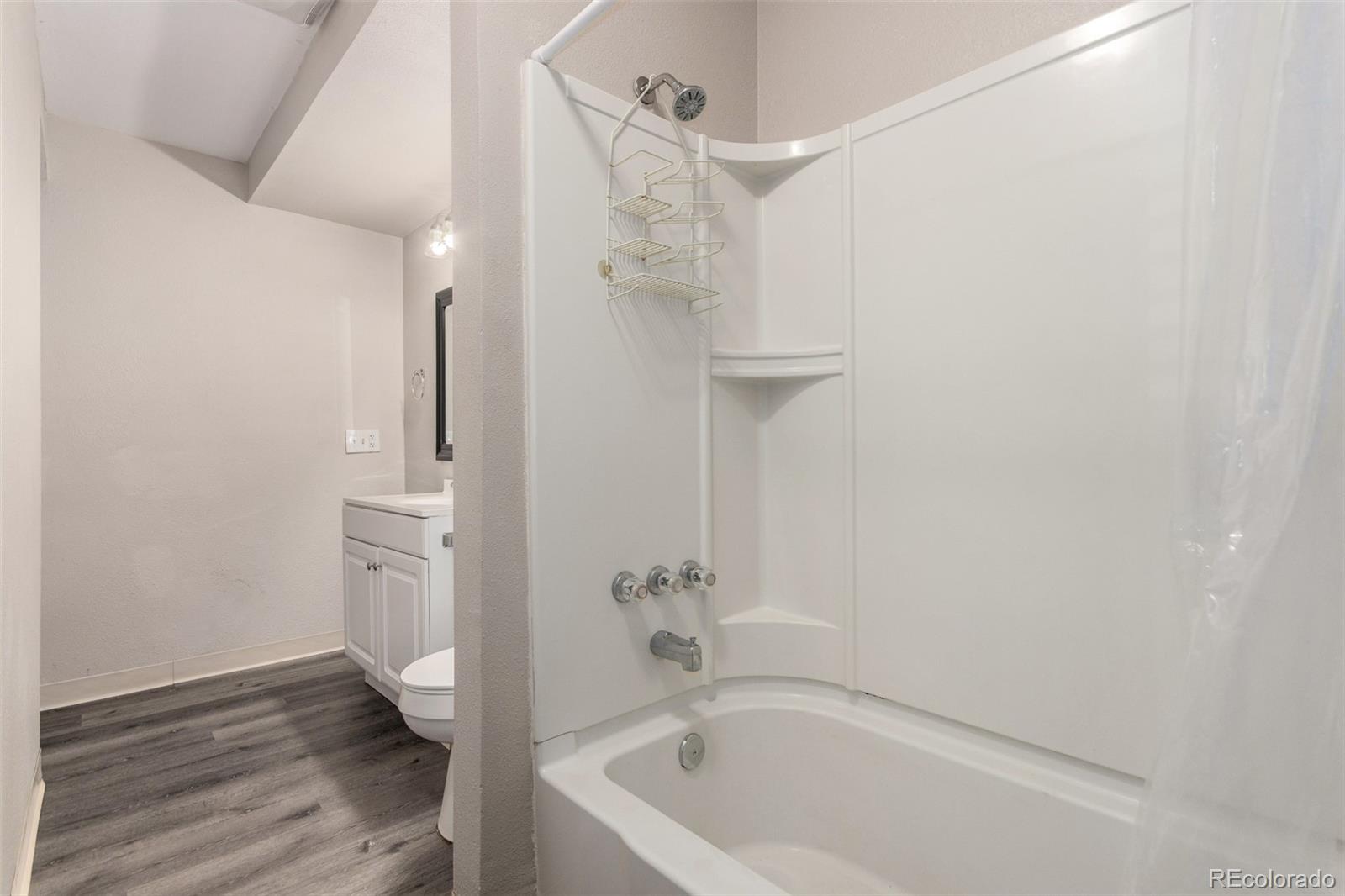 16359 West 10th Avenue, Unit O Golden, CO 80401 - Photo 20 of 25 a bathroom with a bathtub and shower