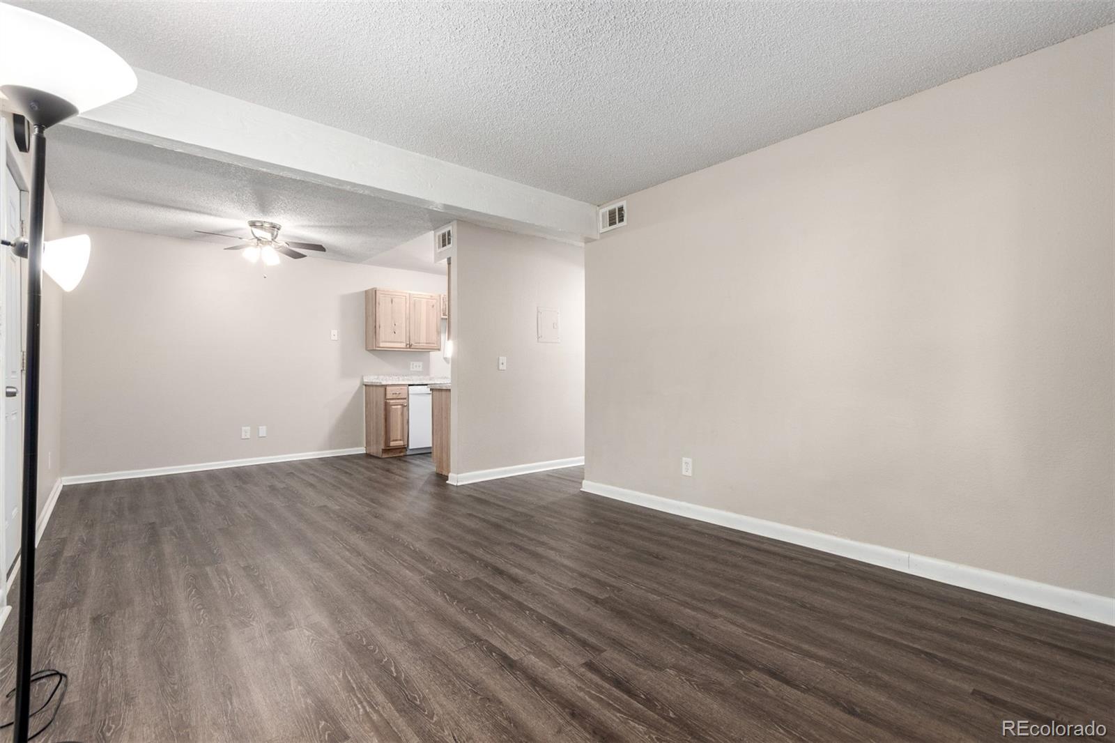 16359 West 10th Avenue, Unit O Golden, CO 80401 - Photo 8 of 25 a view of empty room with wooden floor