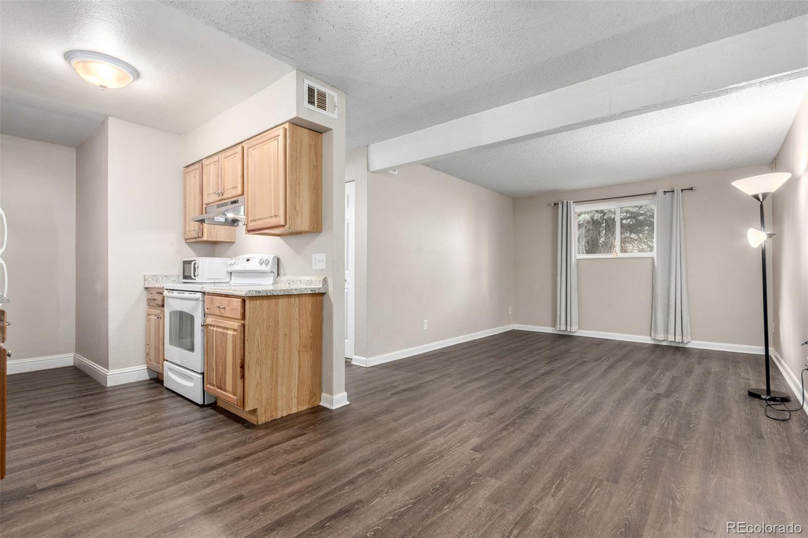 16359 West 10th Avenue, Unit O Golden, CO 80401 - Photo 9 of 25 a view of kitchen with sink and wooden floor