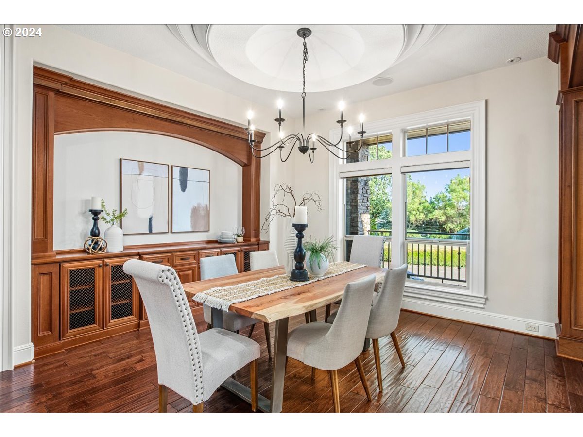 9400 Southwest Inverness Way Beaverton, OR 97007 - Photo 6 of 48 a view of a dining room with furniture wooden floor and chandelier