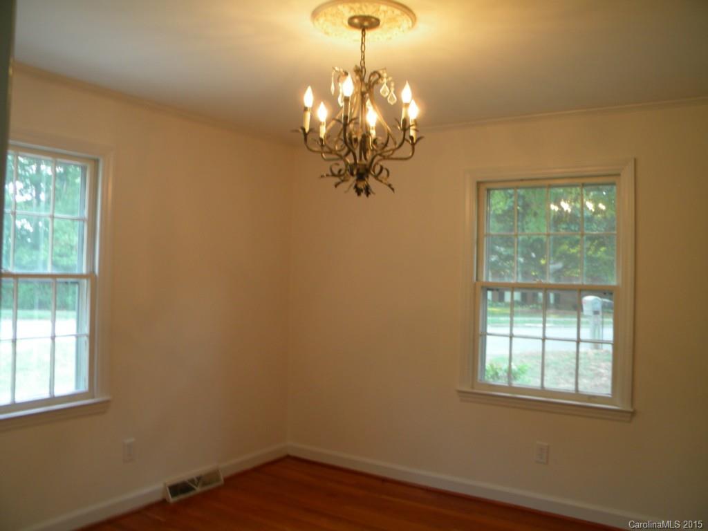 305 Pine Road Davidson, NC 28036 - Photo 3 of 9 a view of a chandelier in a room with a window