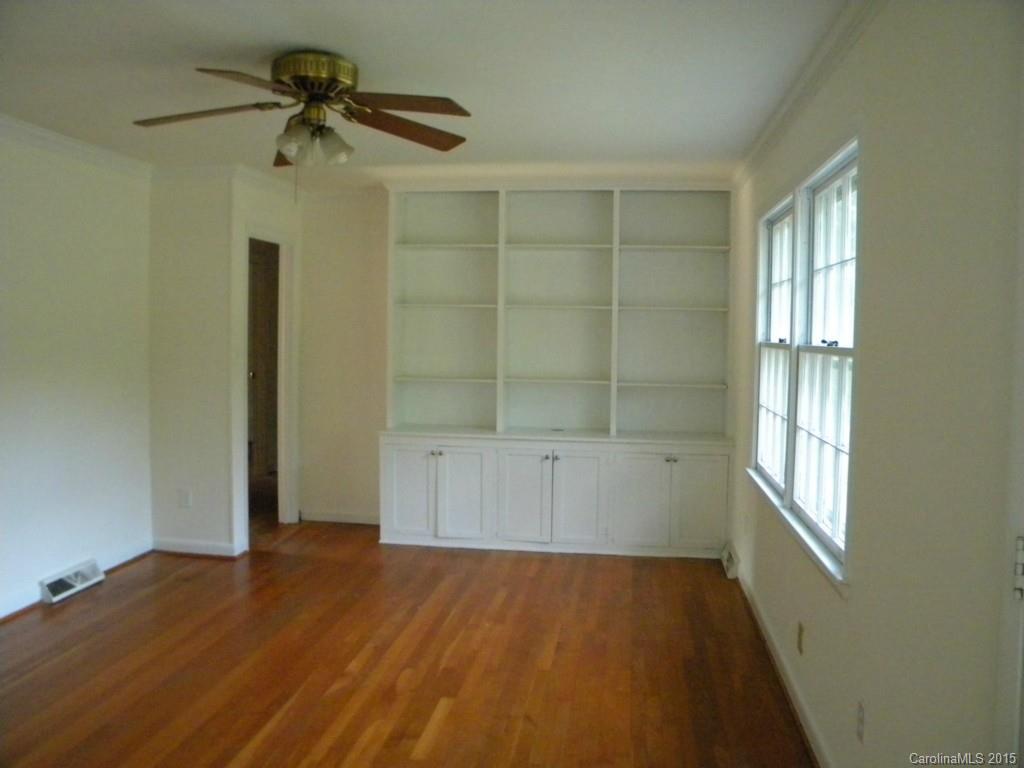 305 Pine Road Davidson, NC 28036 - Photo 5 of 9 an empty room with a empty space and windows